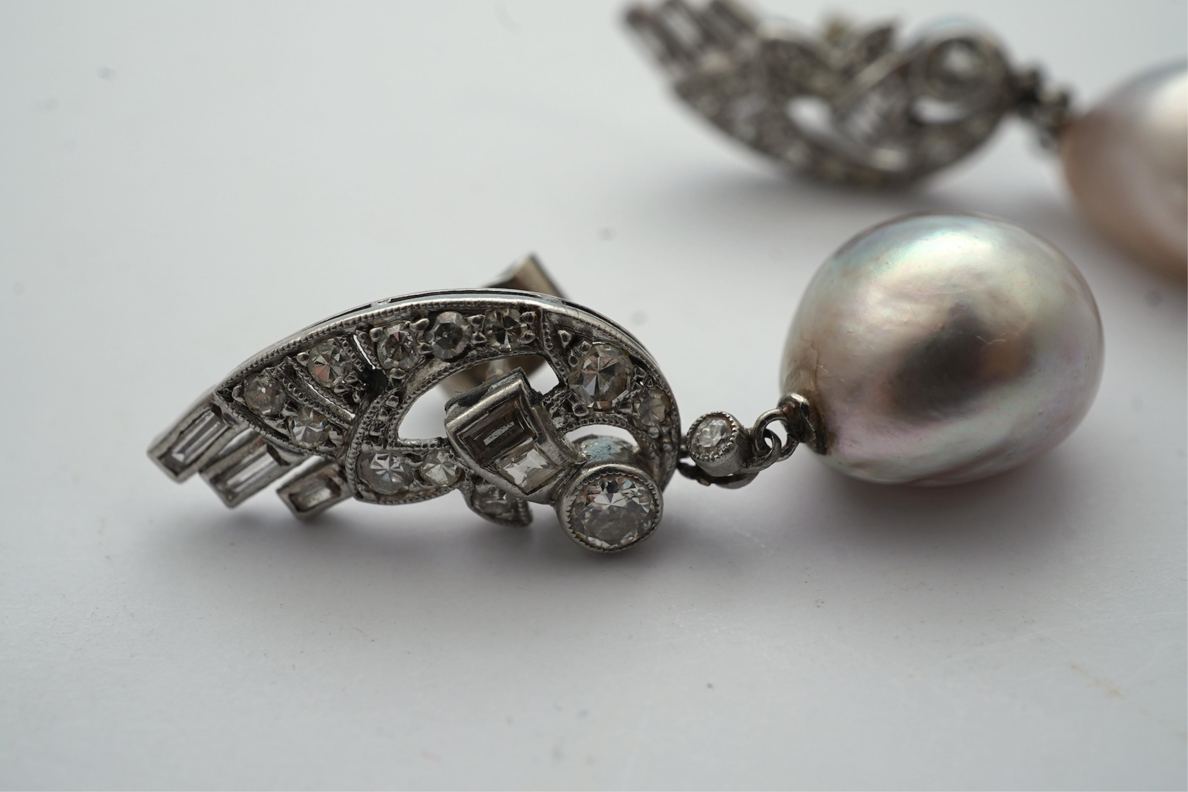 A fine pair of Art Deco natural pearl and diamond earrings, 1930s